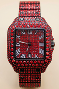 Red sparkling rectangular Roman numeral watch on a neutral ivory background