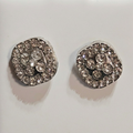 Close-up of silver-tone sparkling cushion cluster stud earrings