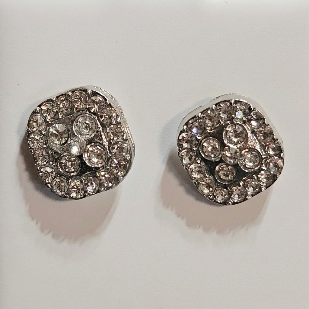 Close-up of silver-tone sparkling cushion cluster stud earrings
