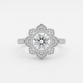 Ornate clear-stone floral ring with a slender silver-tone accent-stone band on white