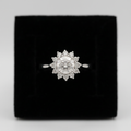 Round clear stone ring with angular geometric shoulder details