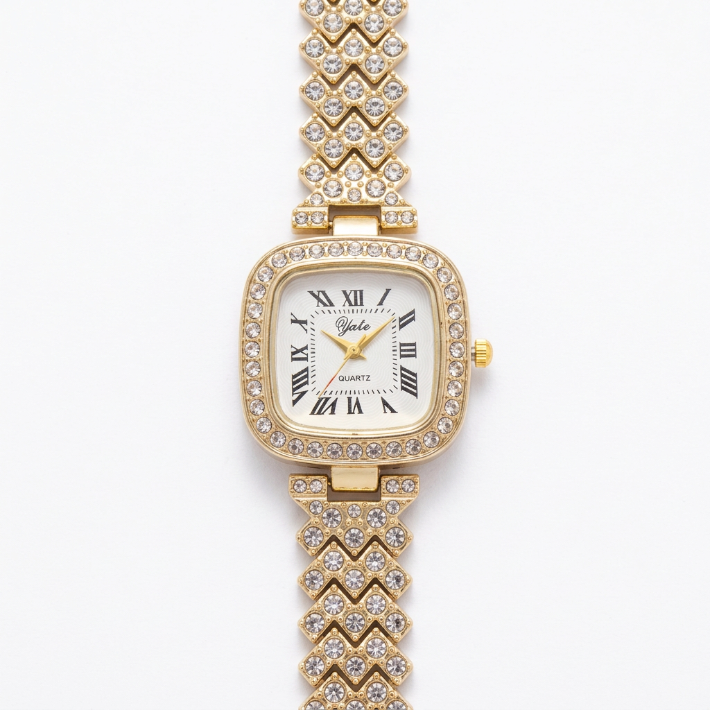 Gold-tone square Roman-numeral watch with clear accent stones and a single bracelet band on white
