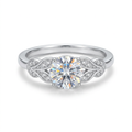 Round clear-stone ring with curved silver-tone accent-stone shoulders on white