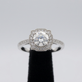 Clear center stone ring with shaped sparkling halo and accented shoulders