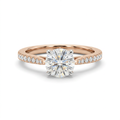 Round clear-stone solitaire ring with polished sweeping shoulders on white