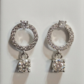 Close-up of silver-tone sparkling open circle drop earrings