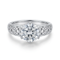 Round clear-stone ring with ornate silver-tone openwork lattice shoulders on white