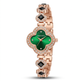 Green clover-dial rose-tone bracelet watch with clear accents and dark square decorative stones on white